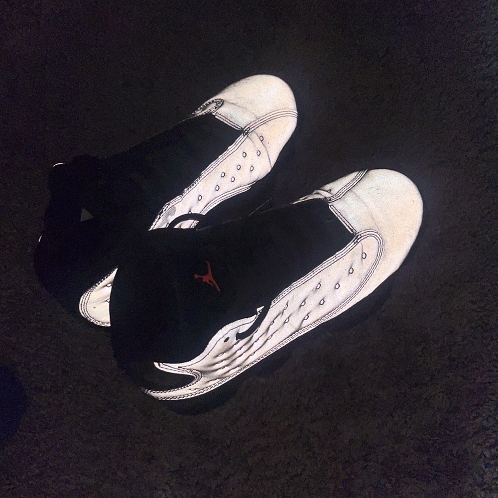Used Air Jordan 13 retro reflective silver.